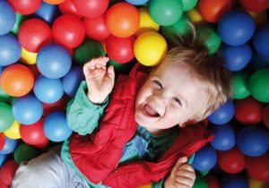 Toddler in Plastic Balls Pit